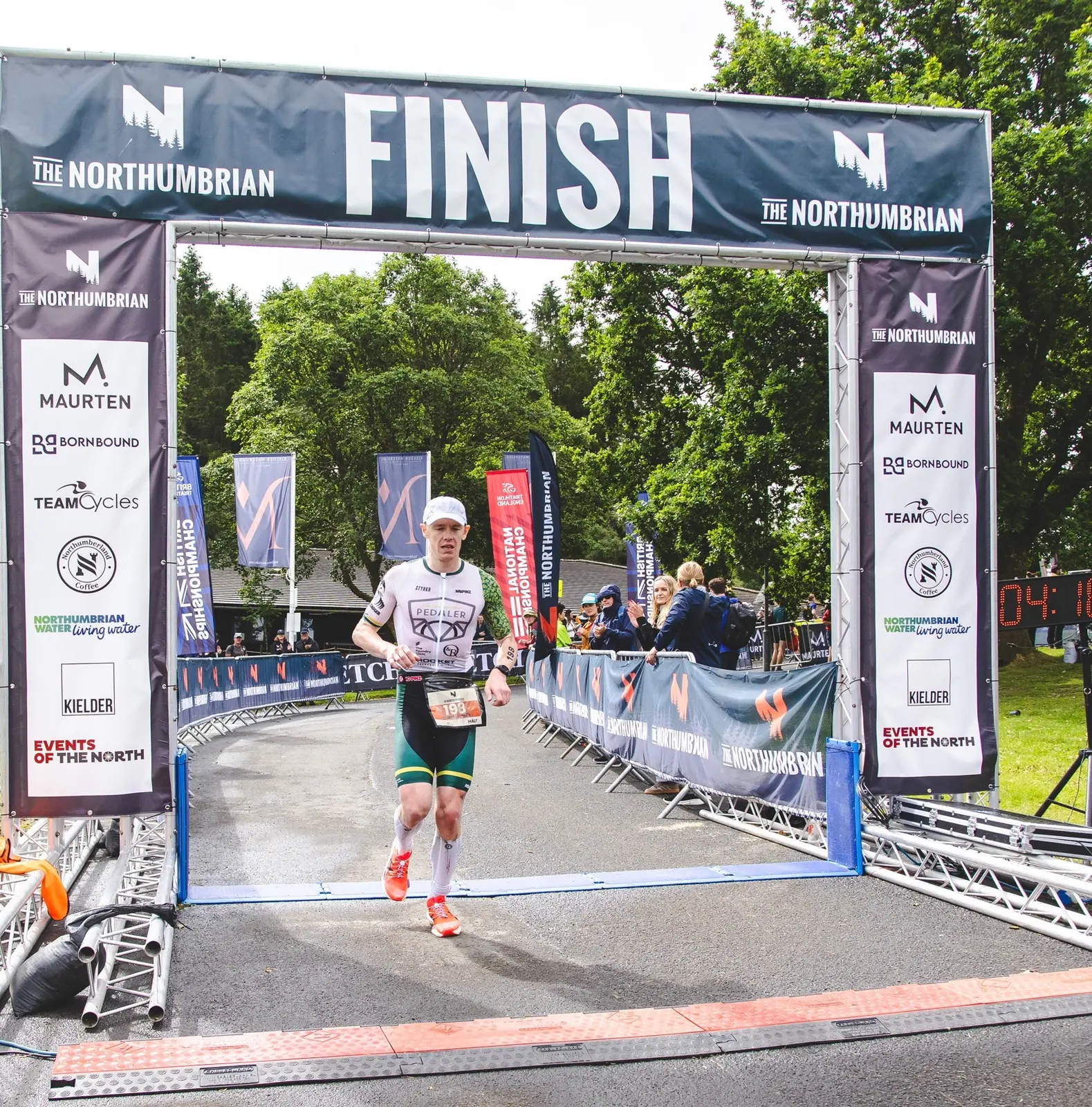 Dr Christopher Fennell crossing the Northumbrian middle-distance finish line