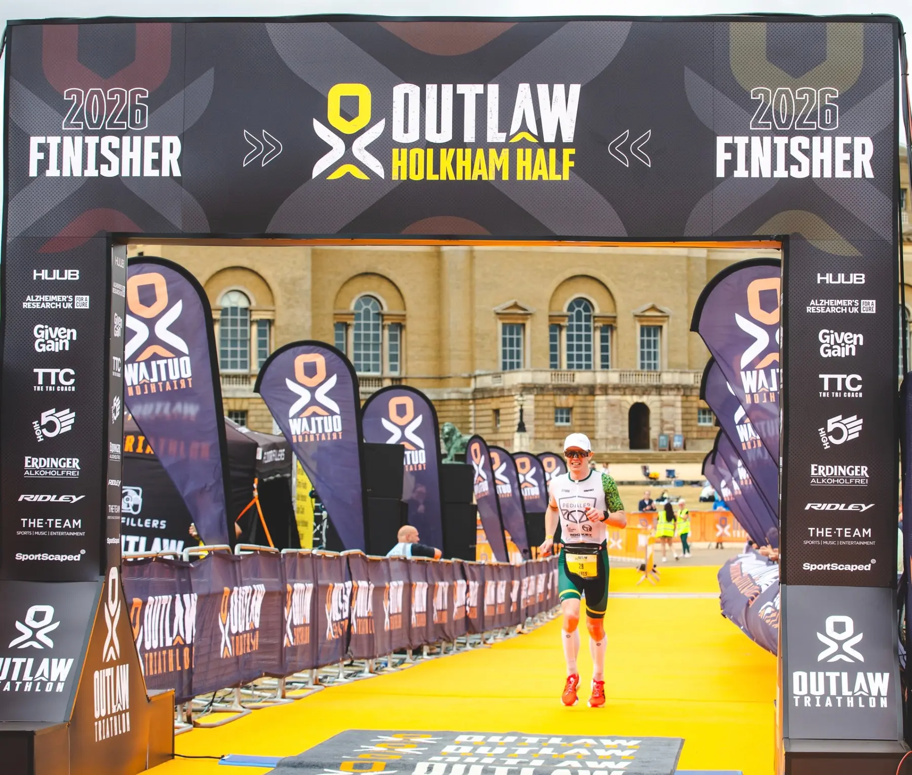 Dr Christopher Fennell finishing Outlaw Holkham 70.3