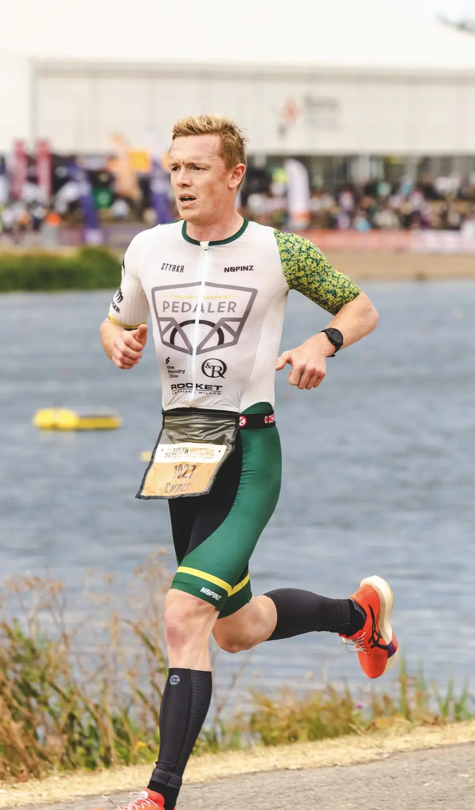 Dr Christopher Fennell running during long-course triathlon competition